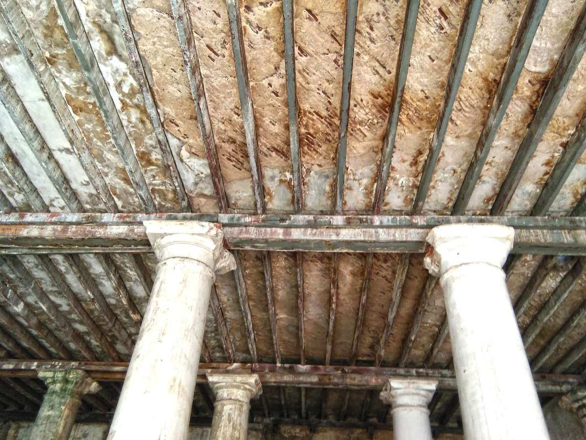 Efflorescence and rust staining on basement masonry and floor beams