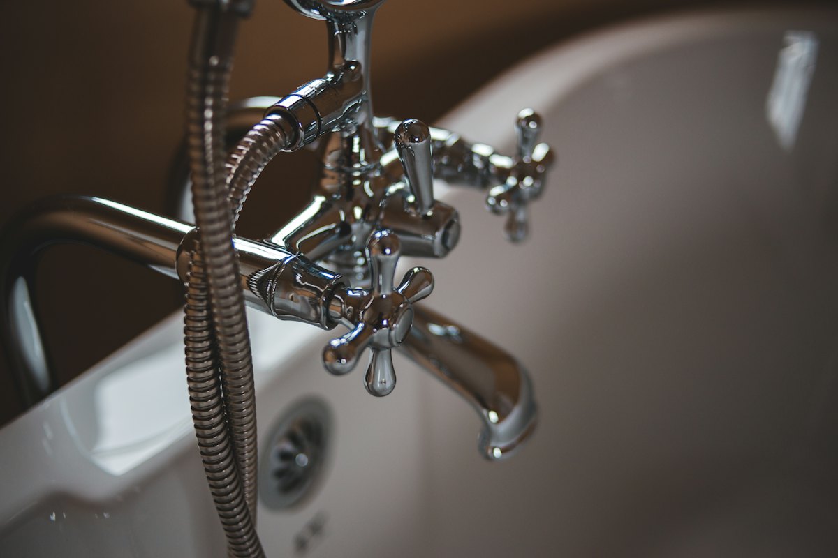 Bathtub faucet and shower fixture in a Tulsa OK home, a common source of overnight water damage