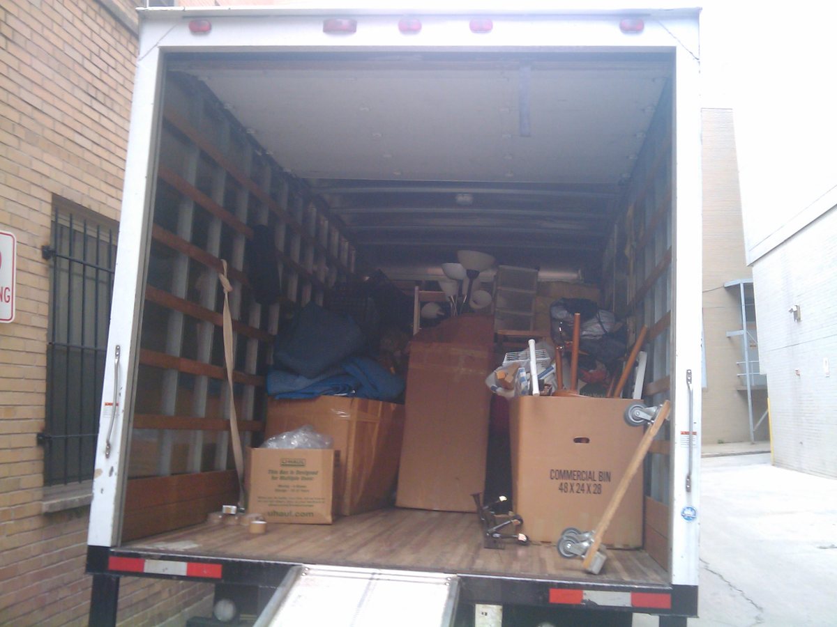 A moving truck loaded with boxed household contents during a pack out