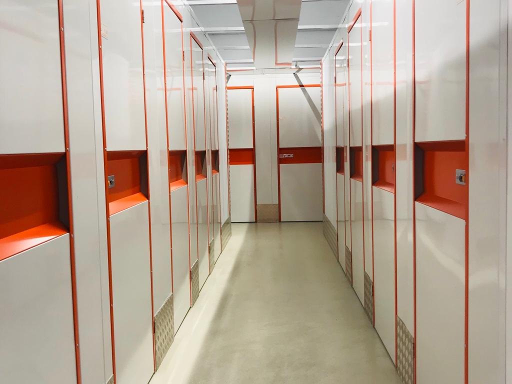 Clean self storage corridor where packed household contents are held during restoration