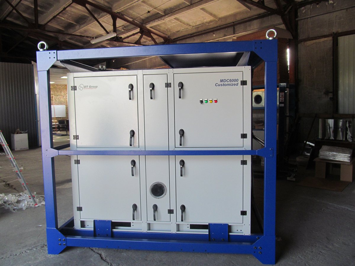 A large industrial rental dehumidifier standing in a warehouse