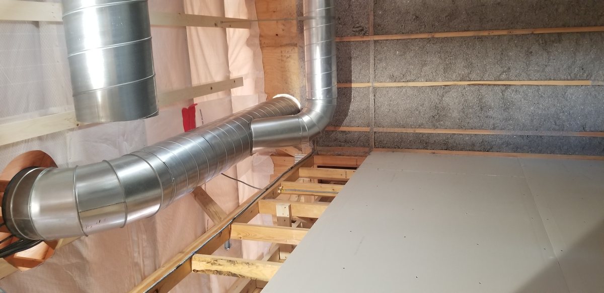 Metal HVAC ductwork running through a building interior