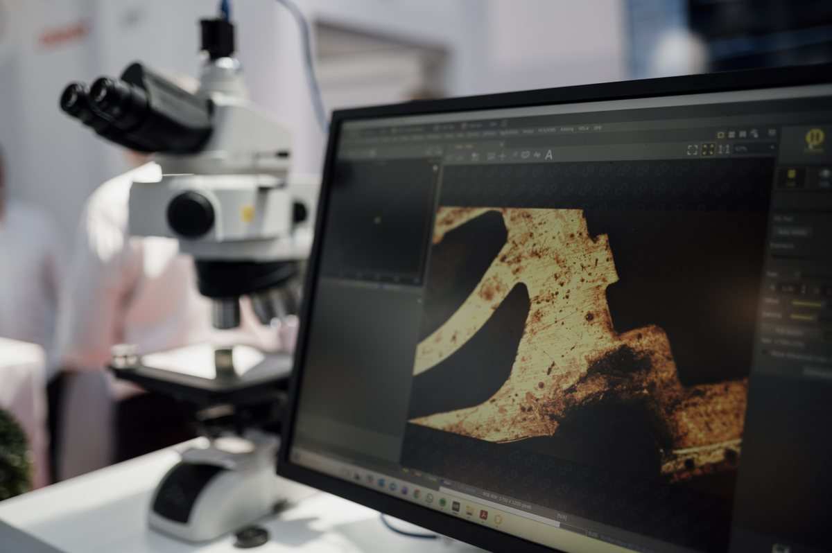 A microscope and monitor used to analyze samples in a laboratory