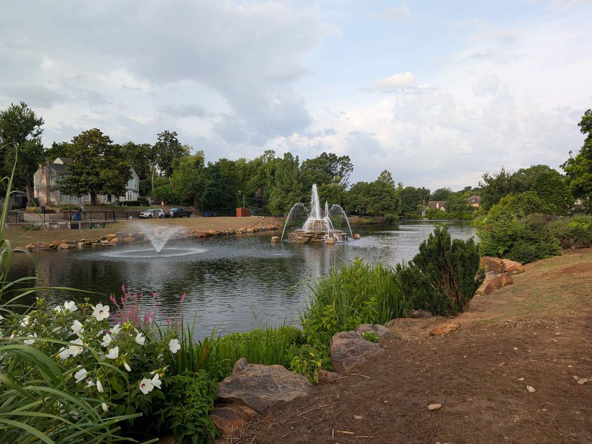 Swan Lake park in Midtown Tulsa, with its fountain and historic homes across the water