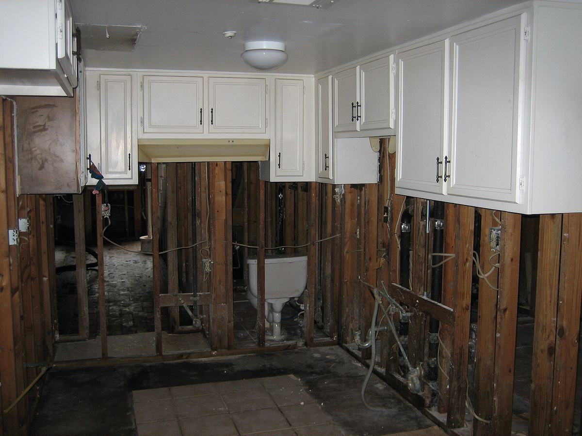 Kitchen and bathroom walls opened to the studs during mold remediation after a flood loss
