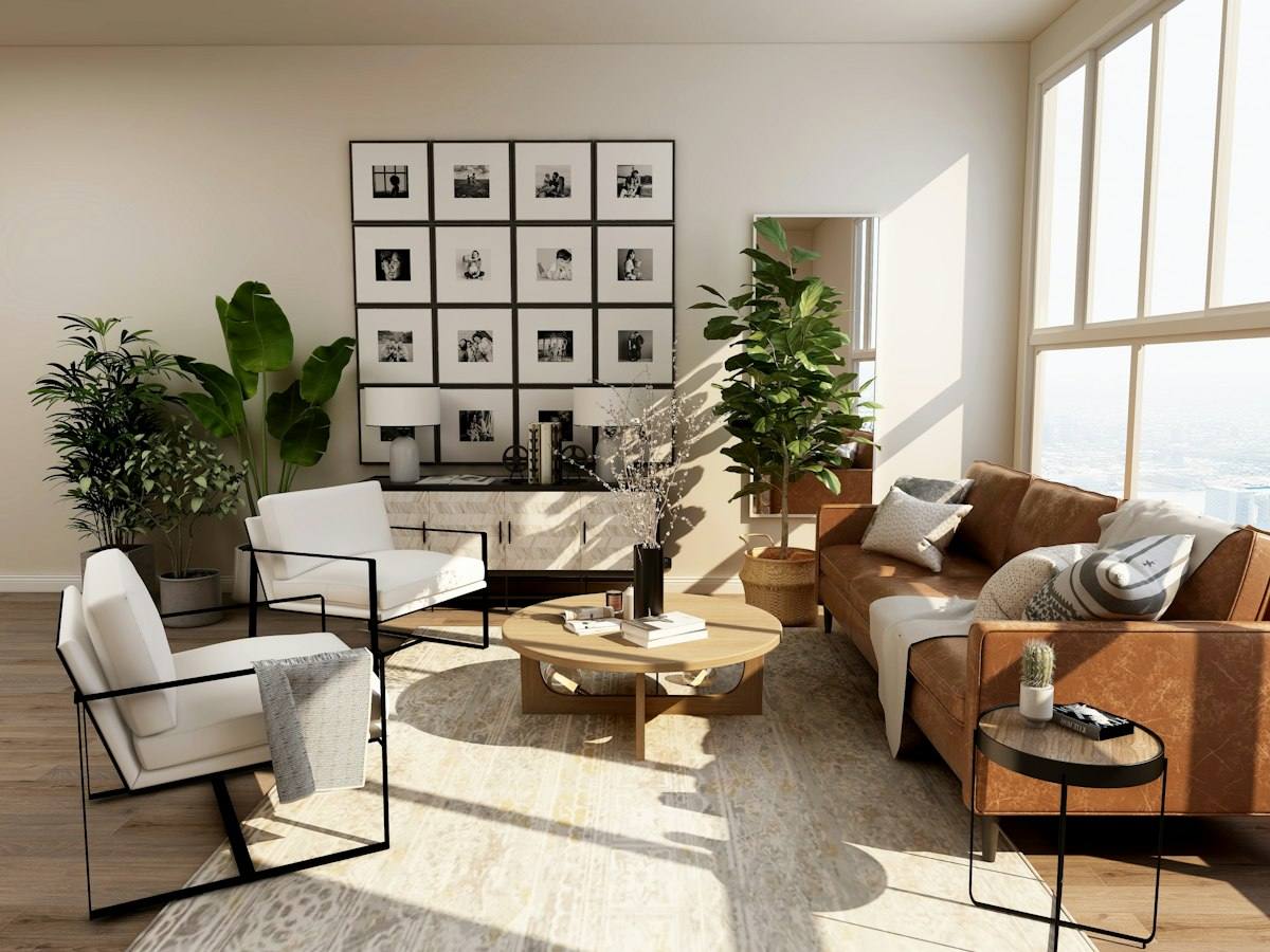 Sunlit, freshly cleaned living room with leather sofa and plants in a Tulsa OK home after water damage odor removal