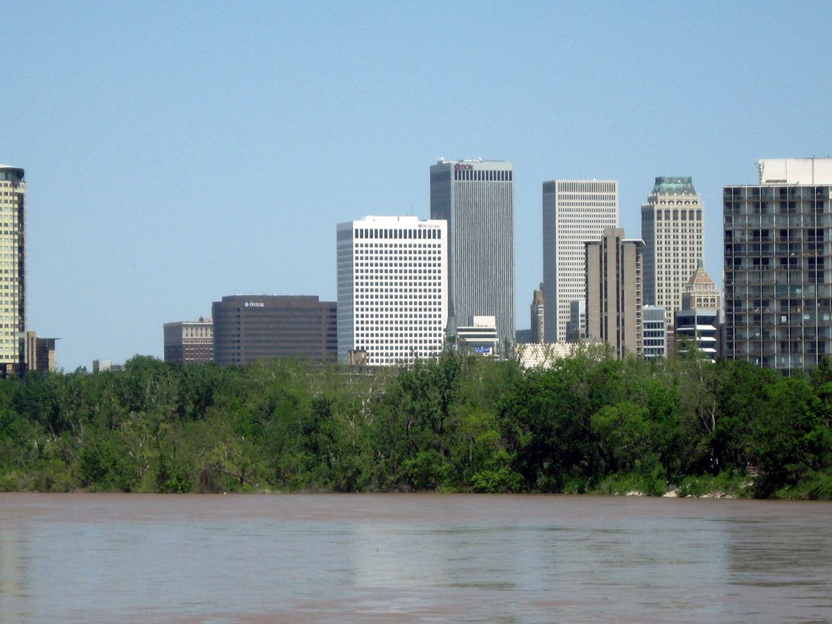 The Tulsa skyline across the Arkansas River, at the center of our service area