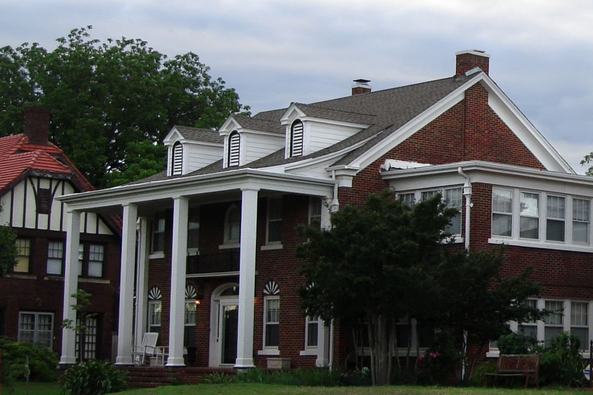 Large brick home with white columns in an Oklahoma historic district, representative of Sperry older homes