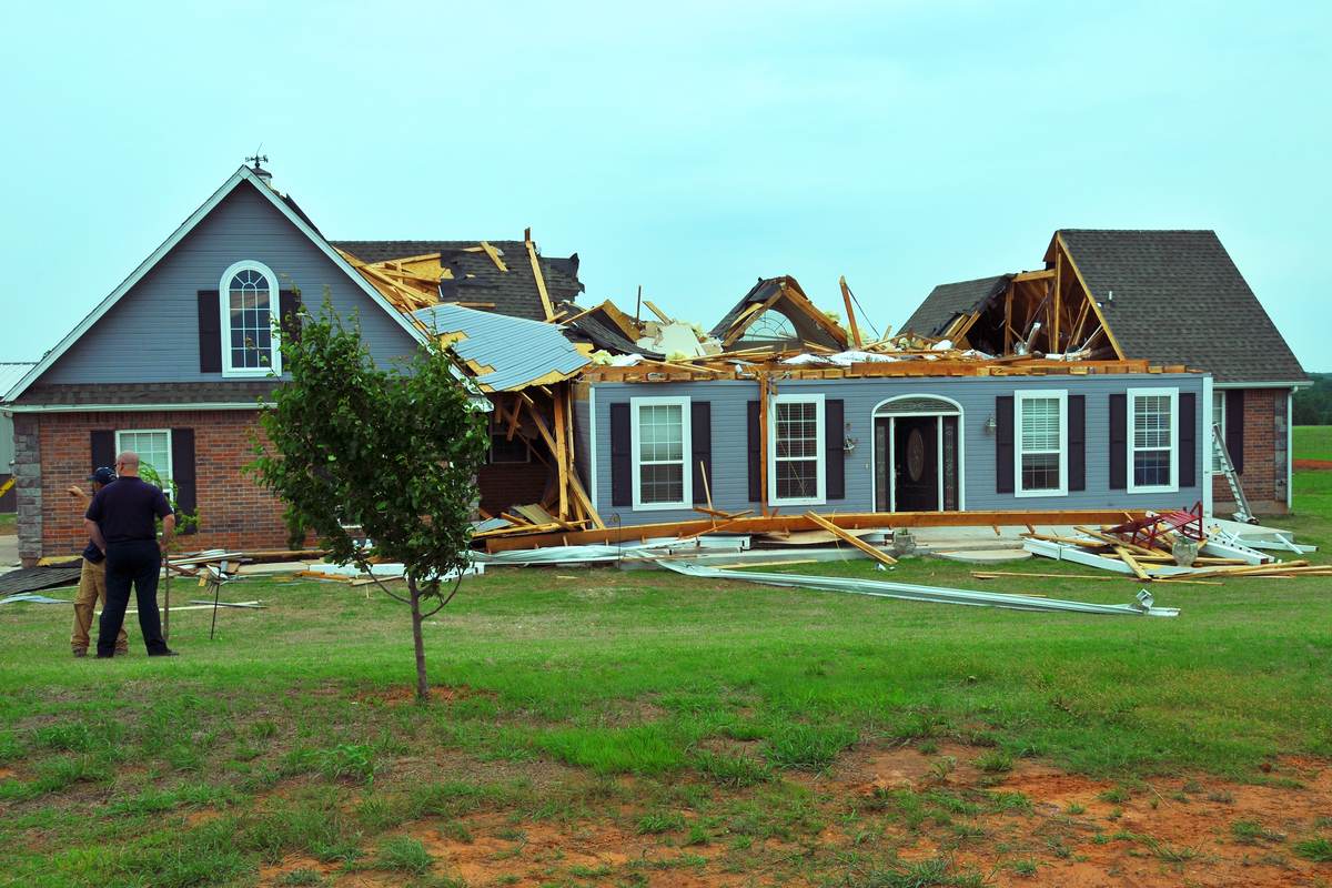 An Oklahoma home with its roof torn open by a tornado