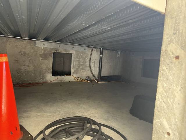 Concrete walled basement space in a Tulsa home where moisture collects against below grade walls