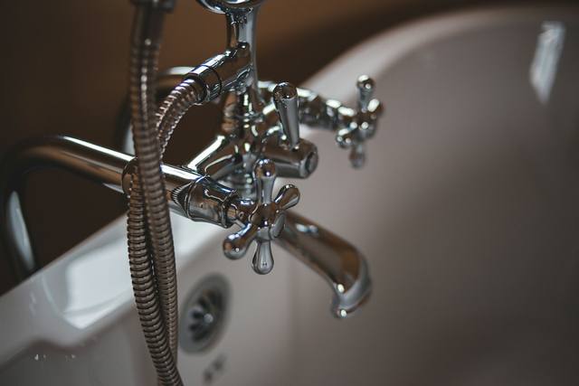 Bathtub faucet and shower fixture in a Tulsa OK home, a common source of overnight water damage
