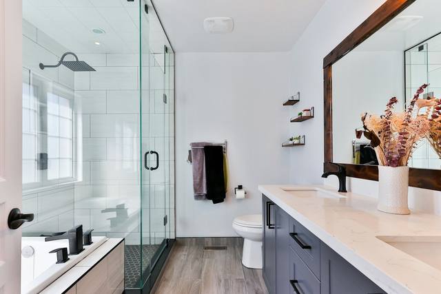 Bright bathroom interior in a Tulsa OK home, where leaks and overflows often start water damage emergencies