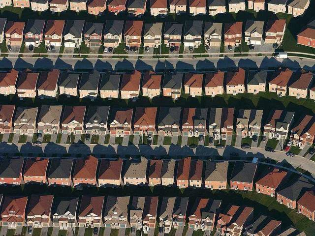 An aerial view of a newer suburban subdivision with large homes on generous lots