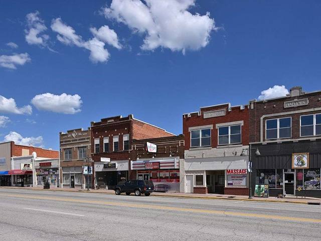 Brick storefronts along a small town Oklahoma main street, representative of Collinsville older commercial core