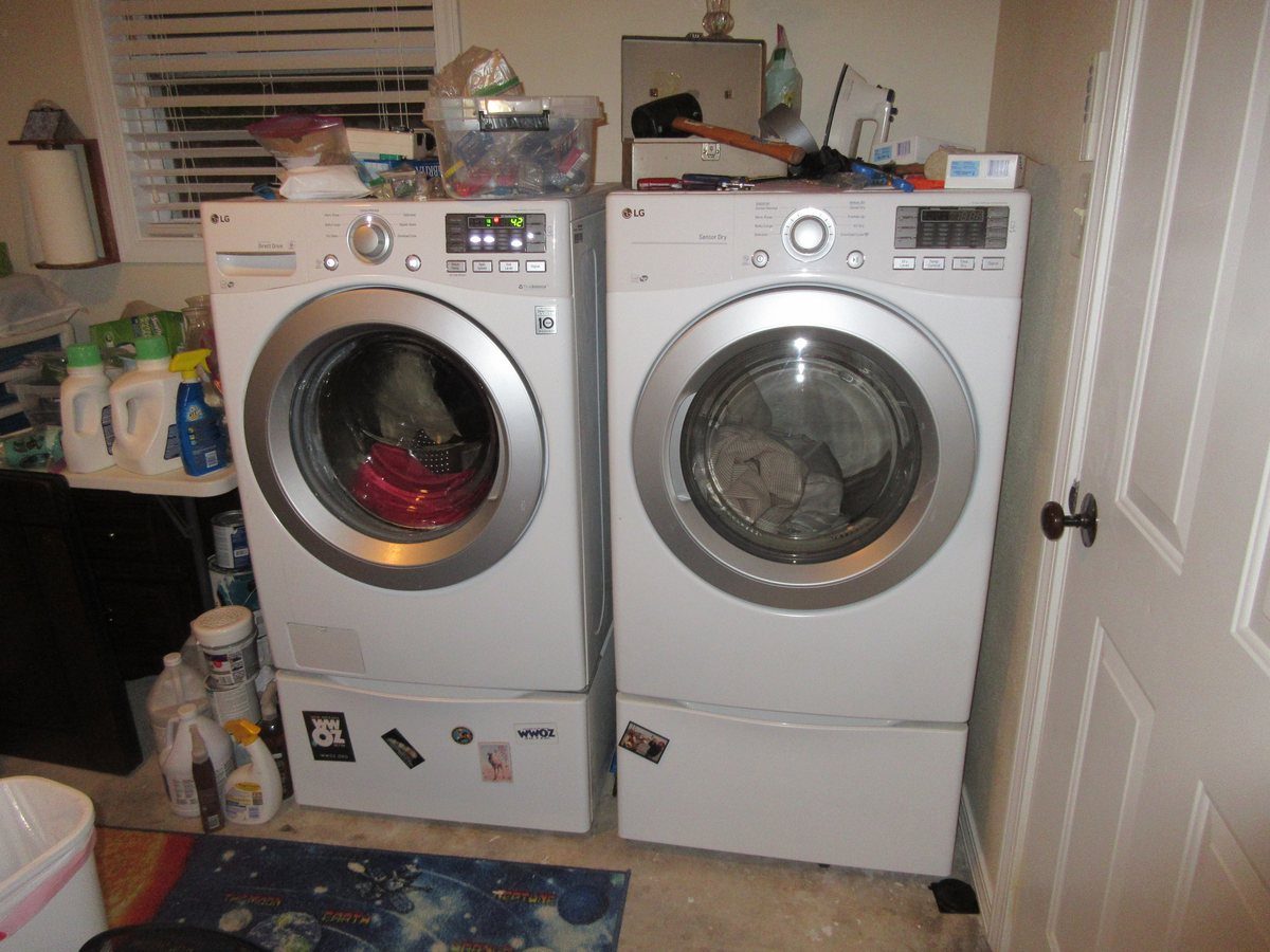 A front load washer and dryer in a home laundry room
