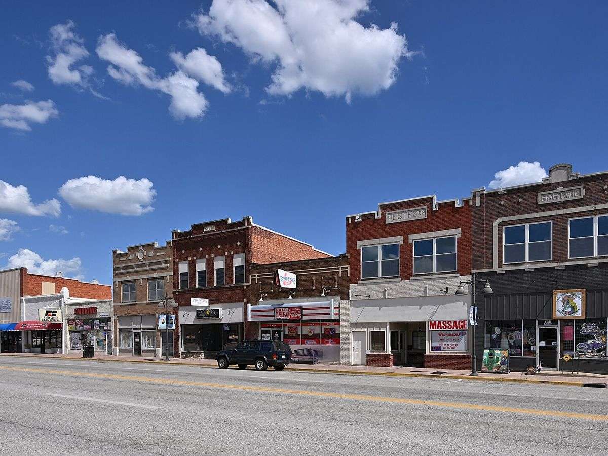 Brick storefronts along a small town Oklahoma main street, representative of Collinsville older commercial center