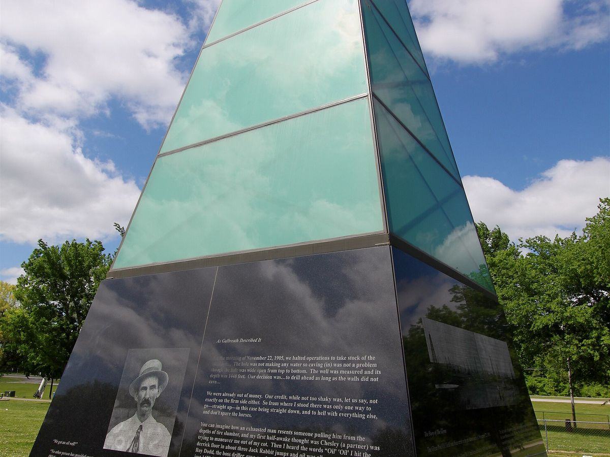 Glass monument at Black Gold Park in Glenpool, Oklahoma, honoring the Glenn Pool oil discovery