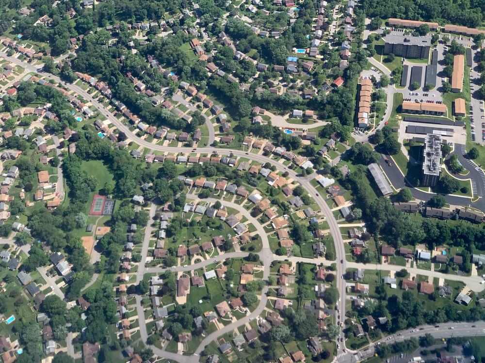 An aerial view over a suburban neighborhood of homes